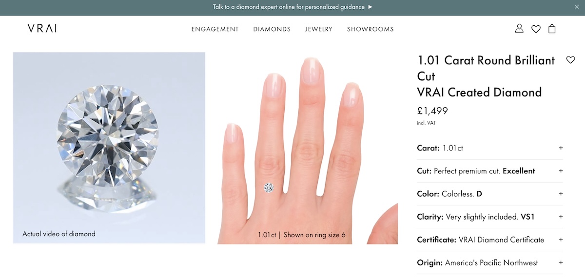 Close-up view of a 1.01 Carat Round Brilliant Cut diamond on VRAI's website, including details like color, clarity, and origin.
